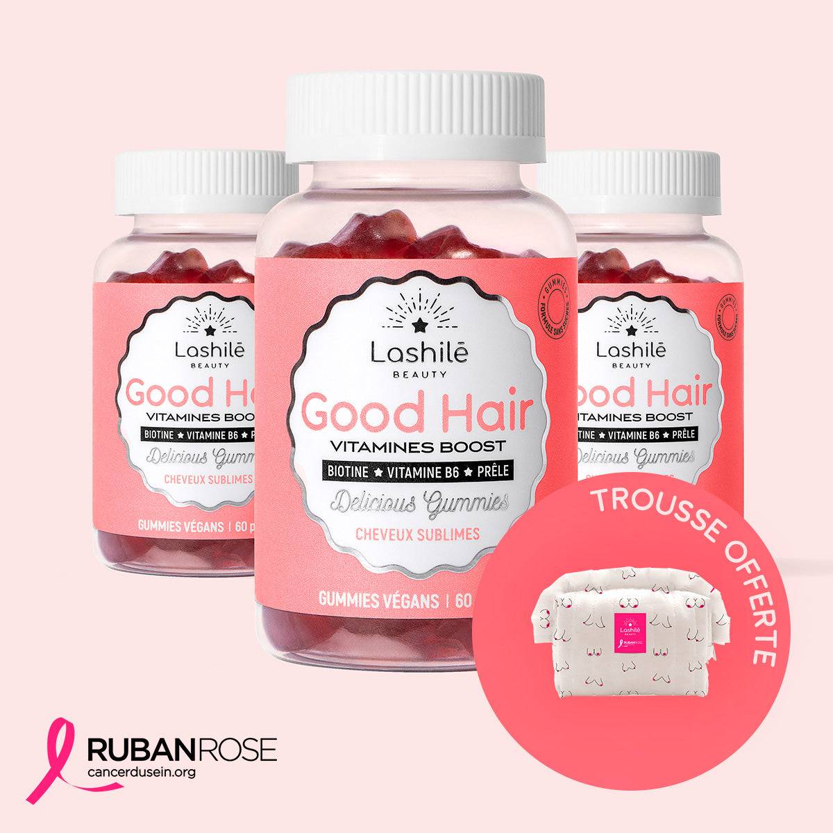 Three bottles of Good Hair vitamin supplements with pink labels and star-shaped gummies.